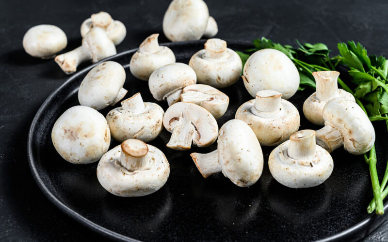 Why is it important to integrate picking lorries with shelving systems in mushroom farms